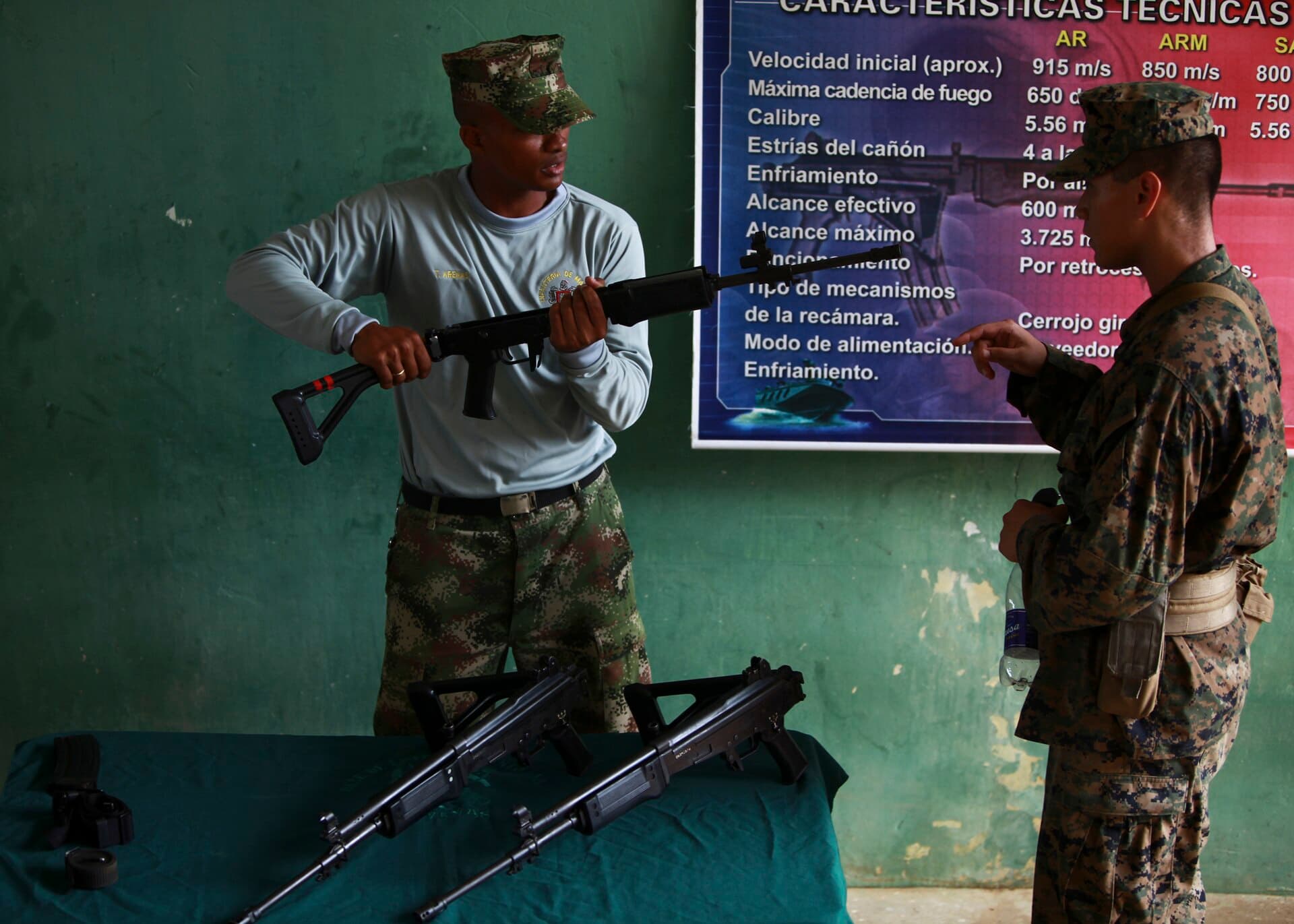 U.S. Marines and sailors attached to Special-Purpose Marine Air-Ground Task Force Continuing Promise 2010 (CP10), receive Colombian Marine weapon clas